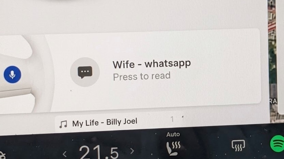 A real Tesla screen showing a NotifyDrive+ notification